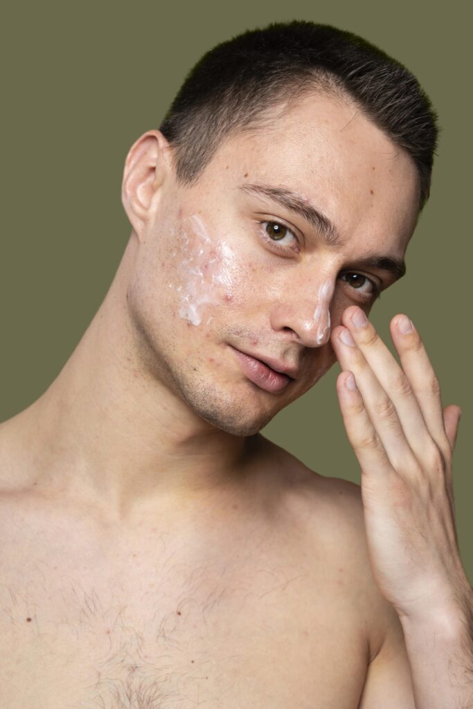 portrait young man being confident with acne